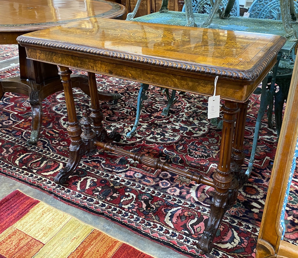 A late Victorian marquetry inlaid burr walnut rectangular folding card table, width 97cm, depth 50cm, height 74cm